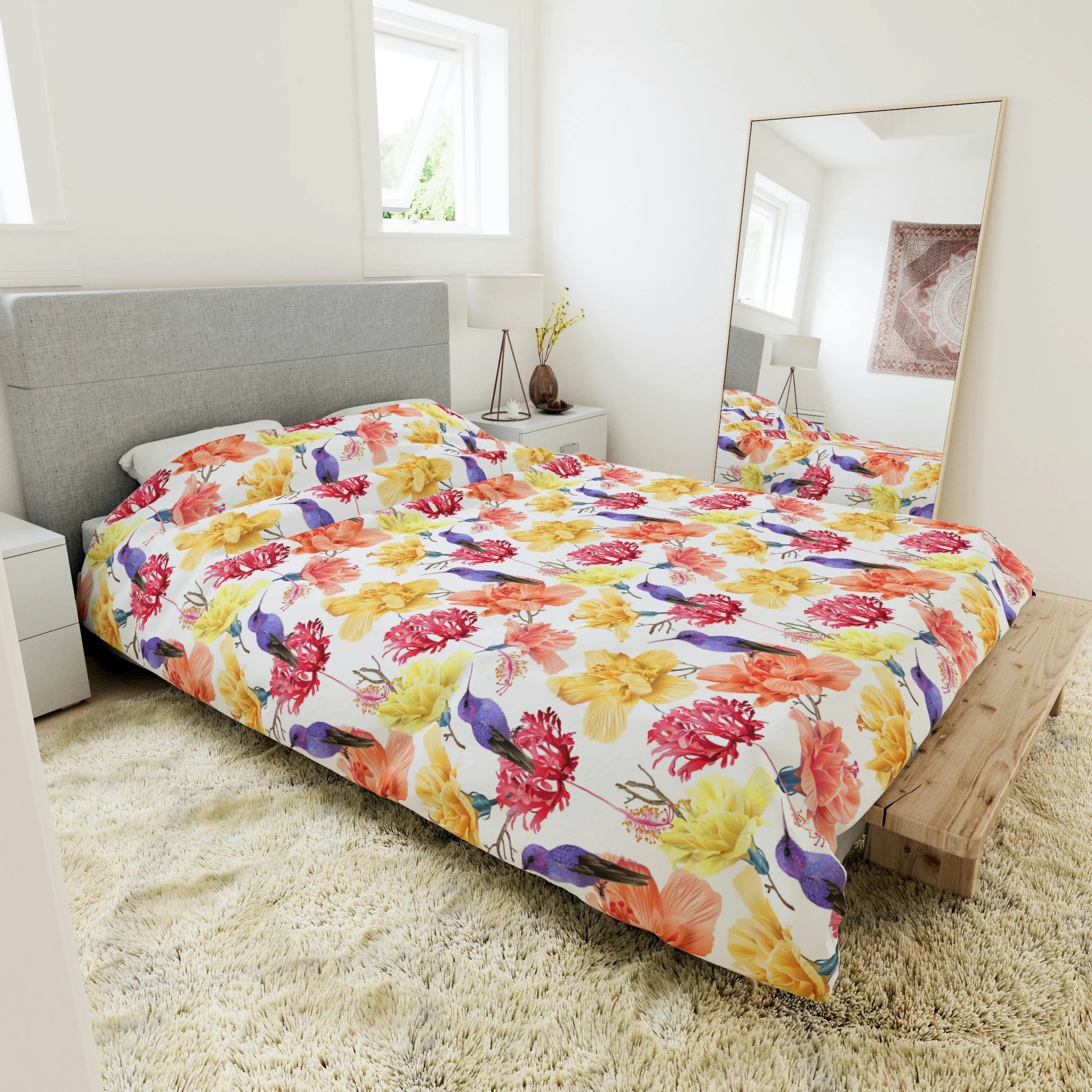 duvet cover with yellow pink and orange flowers on it, floral duvet cover lying on a bed
