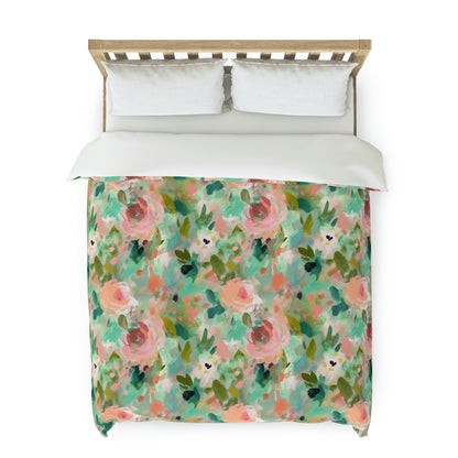pink and green floral duvet cover on a bed, duvet cover with pink and green flowers on it, green duvet cover, pink duvet cover, green and pink abstract floral duvet cover