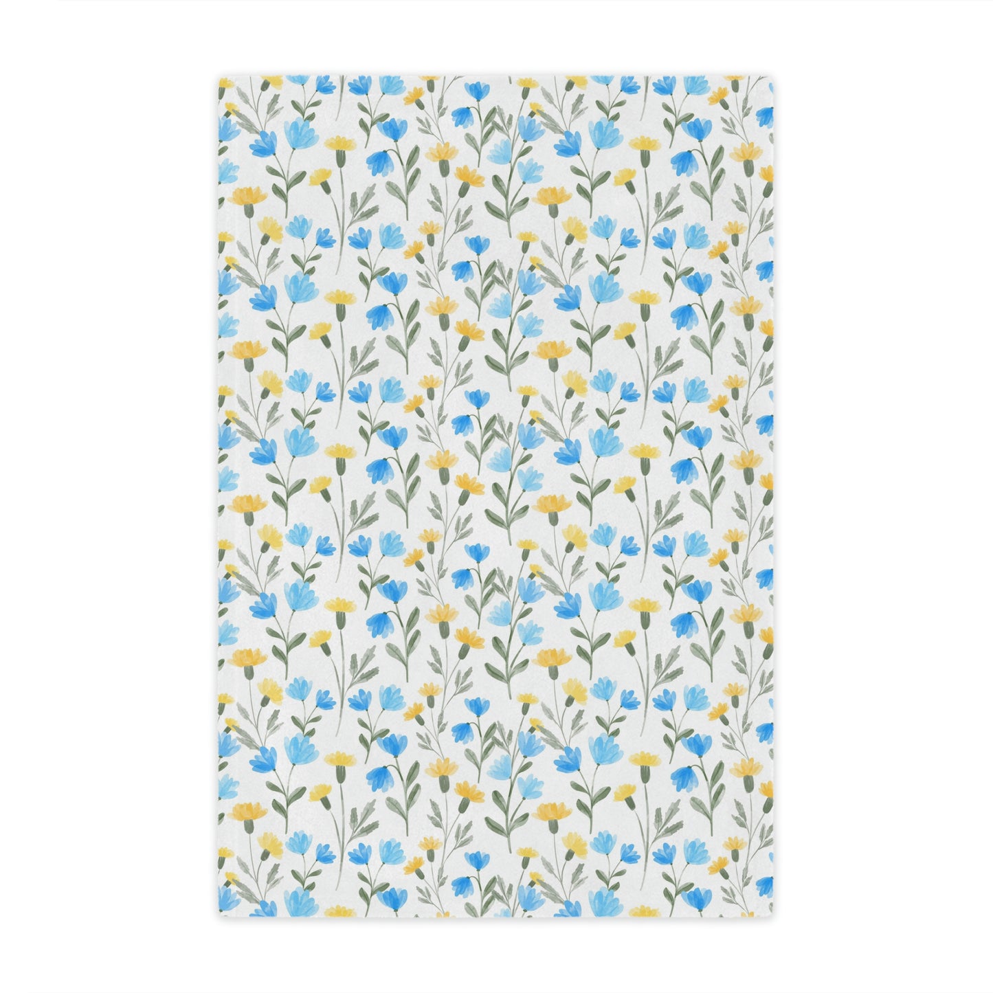 blue and yellow wildflower print on a plush throw blanket, blue and yellow floral throw blanket lying on a bed