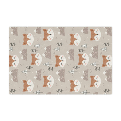 fox theme blanket lying on a bed in a nursery or kids playroom, fox plush blanket on a chair, fox throw blanket in a woodland theme nursery 