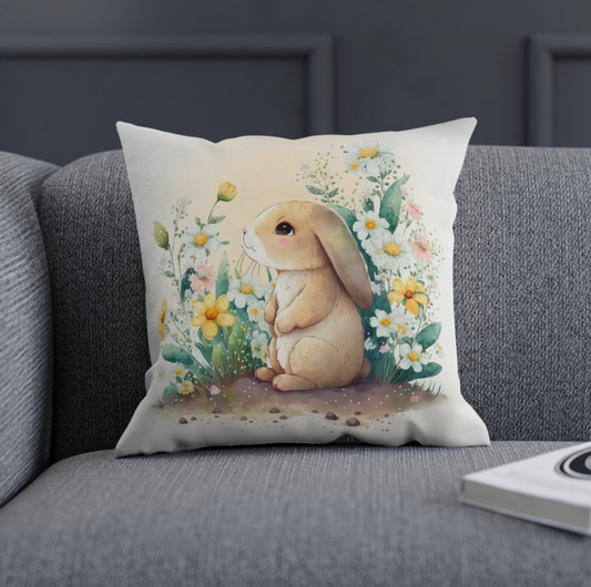 floral bunny accent throw pillow sitting on a couch, grey couch with a bunny theme throw pillow, accent your home with a bunny couch pillow