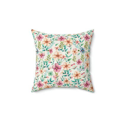 floral accent pillow with pink and blue flower pattern sitting on a chair, floral couch pillow in a living room, pink floral print on a throw pillow sitting on a couch
