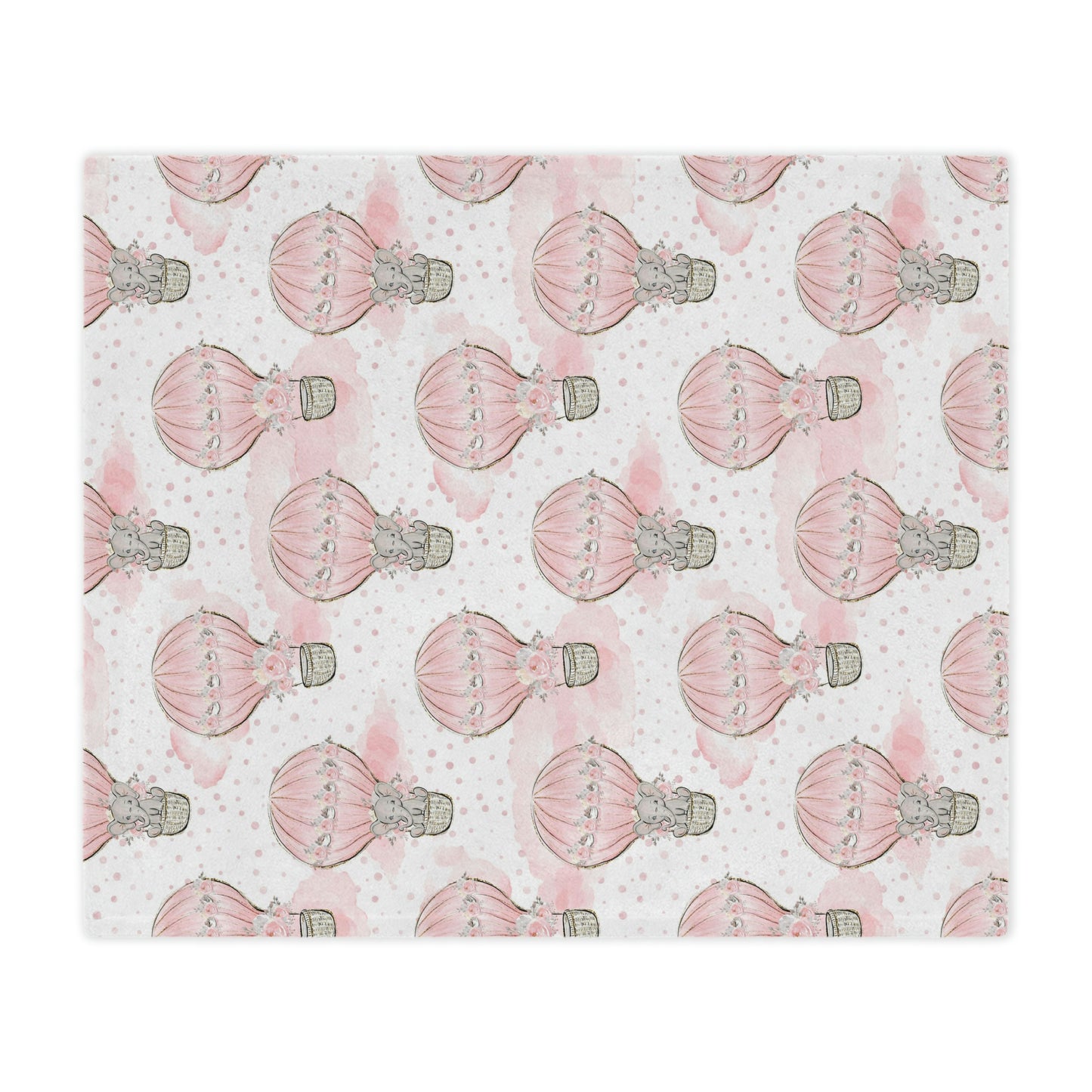 pink elephant in a hot air balloon baby blanket decorating a nursery, pink elephant throw blanket with hot air balloons on it lying on a bed, elephant nursery theme decor blanket accenting a nursery bed