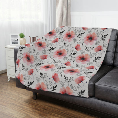 pink flowers with black outlines pattern, pink floral throw blanket lying on a bed, pink flowers on a plush blanket lying next to pillows as part of your bedroom decor