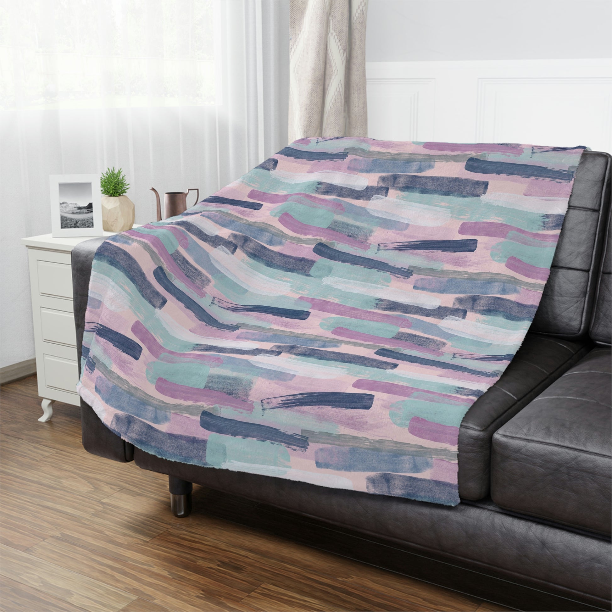 watercolor brush stroke throw blanket on a bed, decorate your bedroom with purple and pink throw blankets on your bedroom, blue and purple plush throw blanket draped on a bed